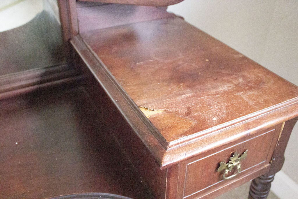Damage to vintage wooden vanity