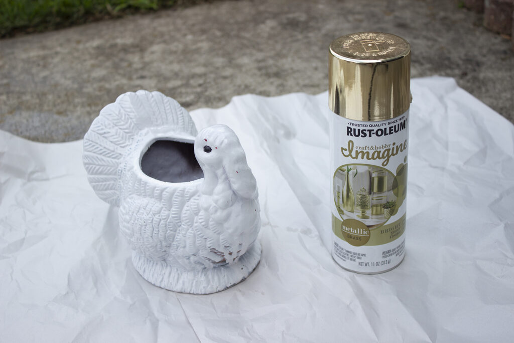 White turkey centerpiece and gold spray paint