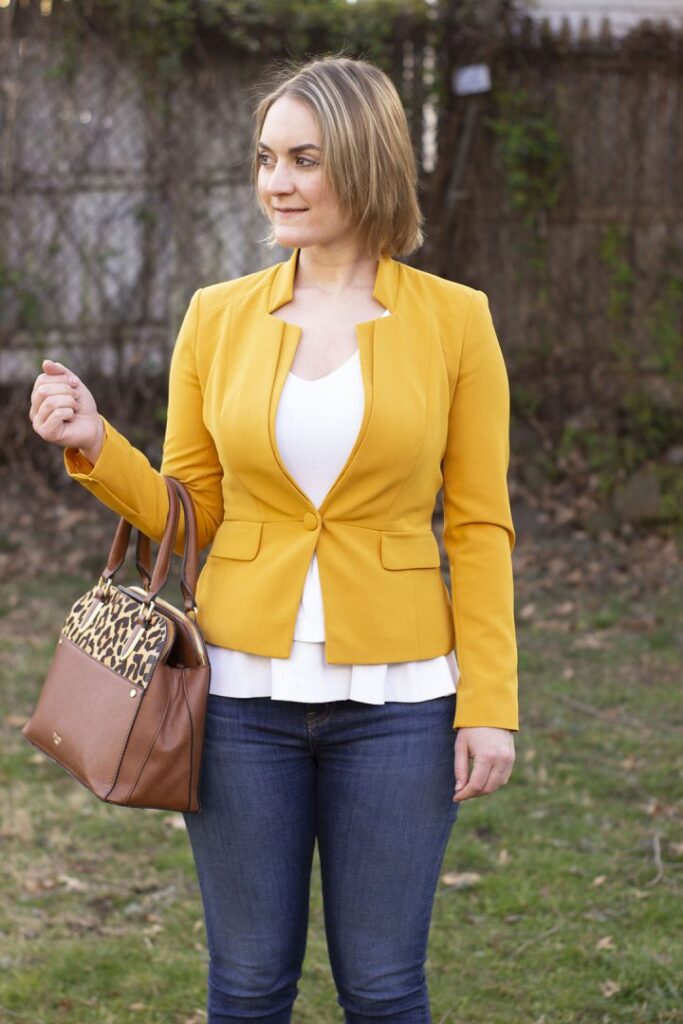 Woman in yellow blazer and jeans