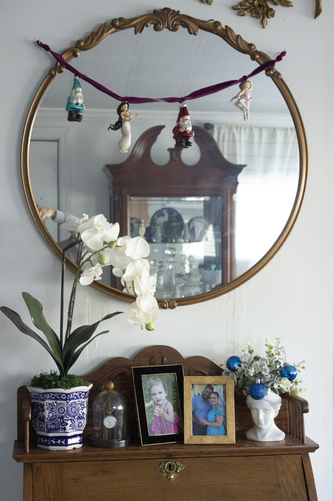 Garland of Christmas Ornaments and shelf full of decor