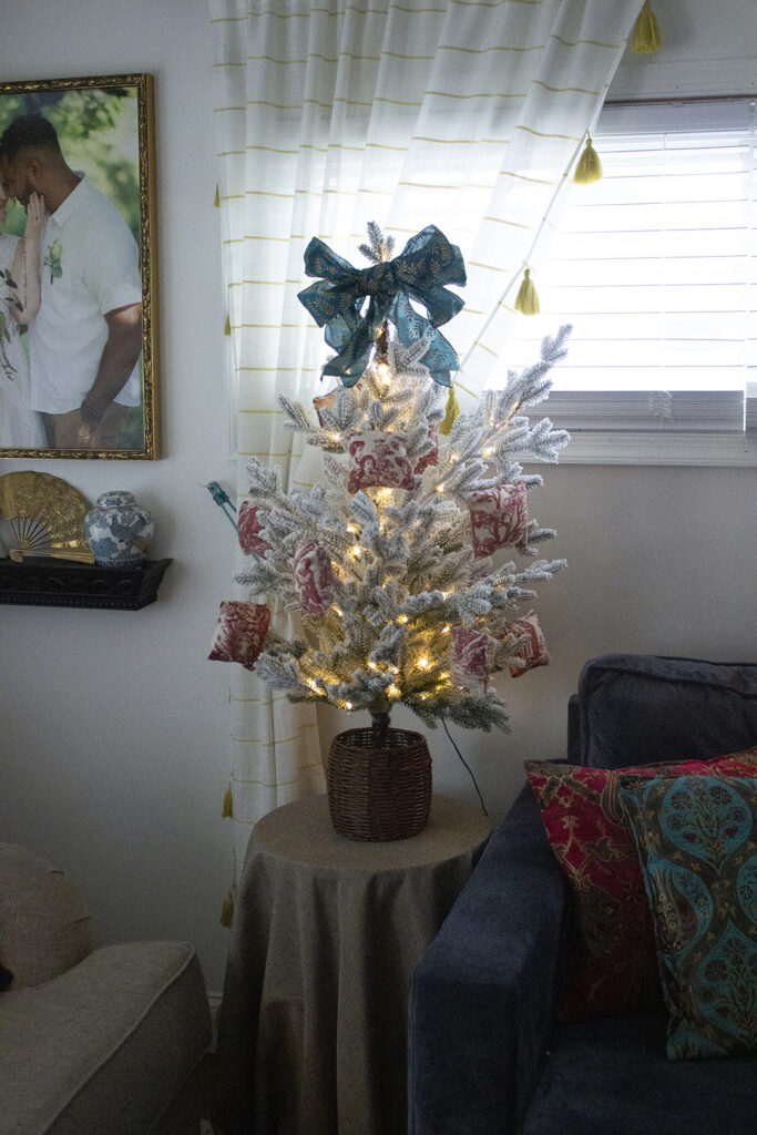 Miniature Christmas tree with lights and bow topper