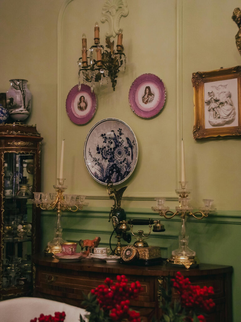 buffet table with plates on wall and sconces