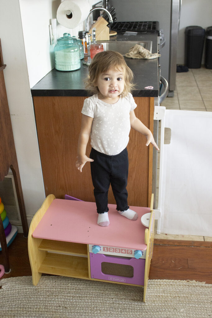 How Do Stay-at-Home Moms Spend Their Day - Little Girl Standing on Toy Oven