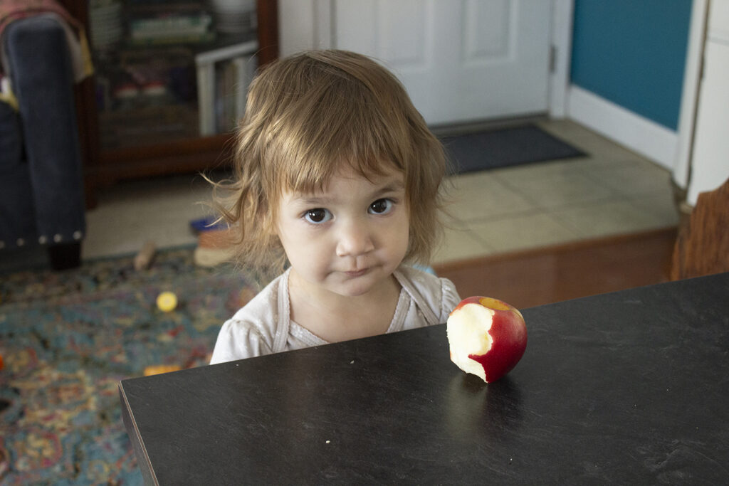 How Do Stay-at-Home Moms Spend Their Day - Little Girl with Apple