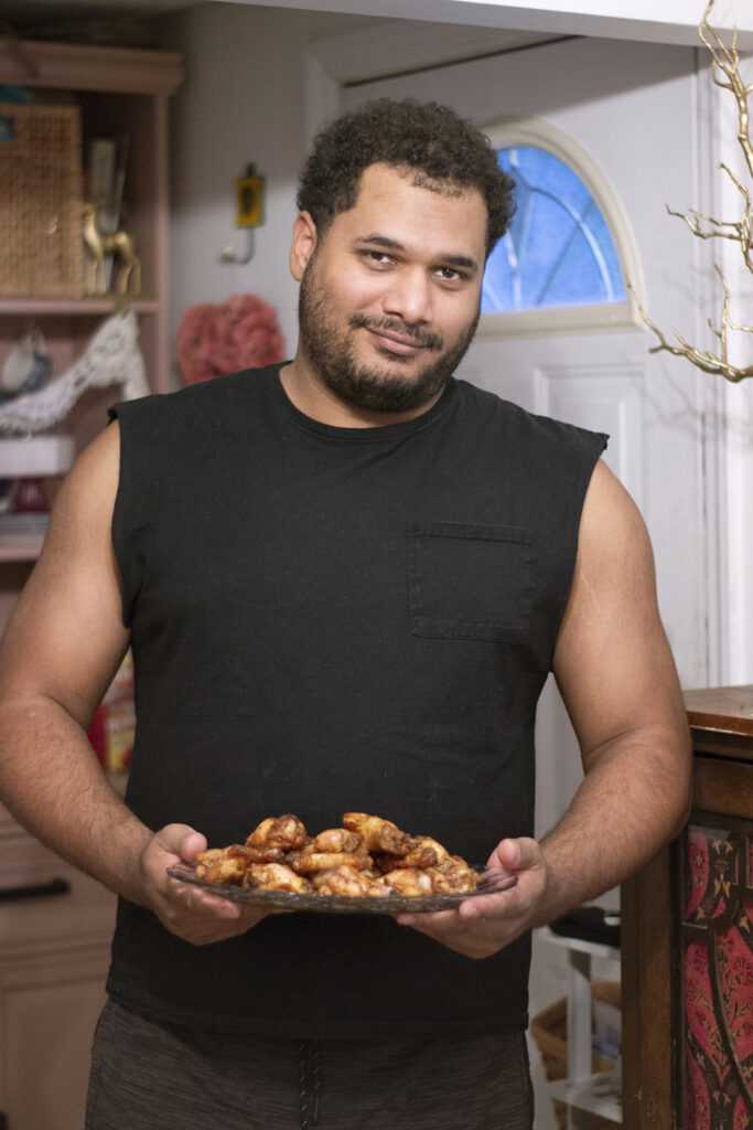 Man Holding Best Air Fryer Chicken Wings