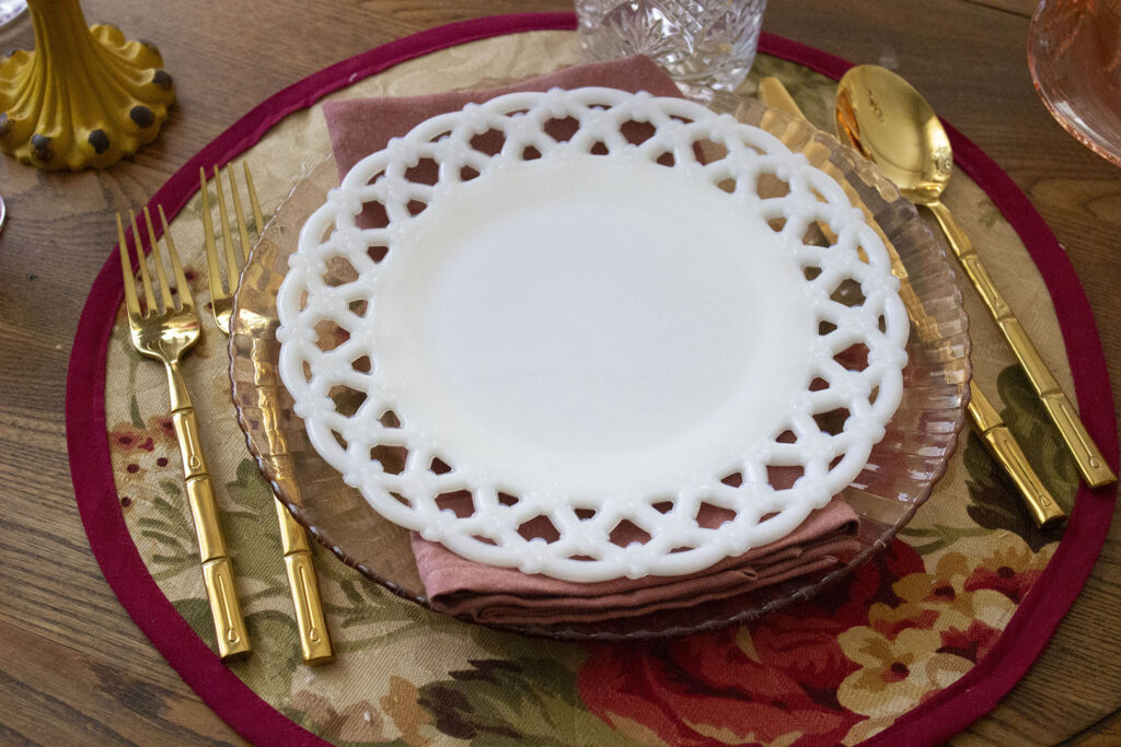 White Milk Glass Plate in place setting with gold bamboo silverware