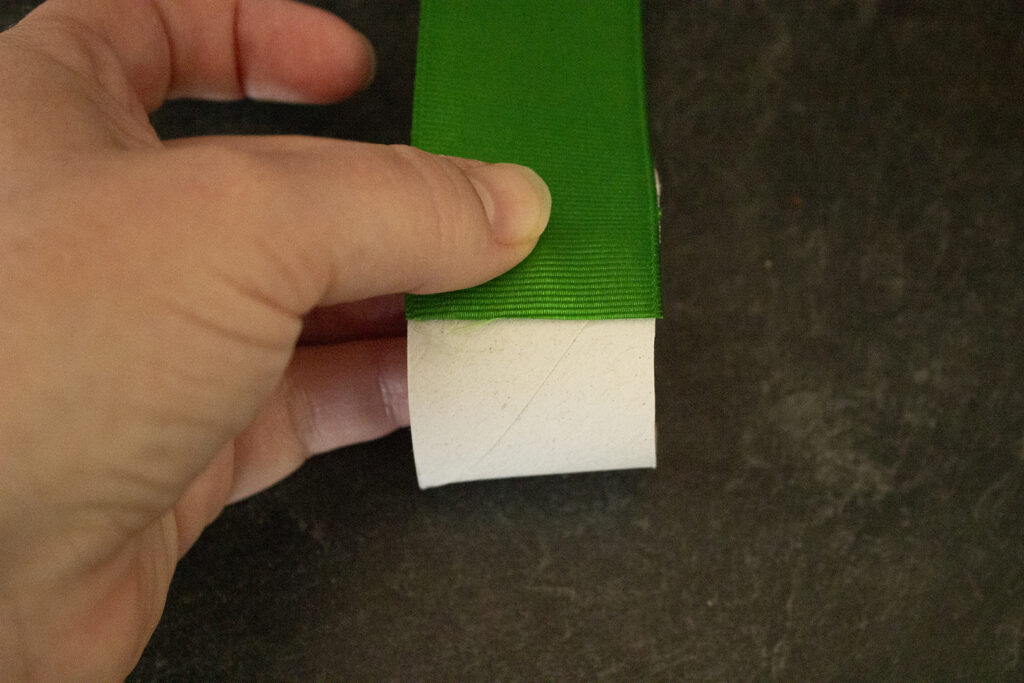 Gluing ribbon to a paper towel tube