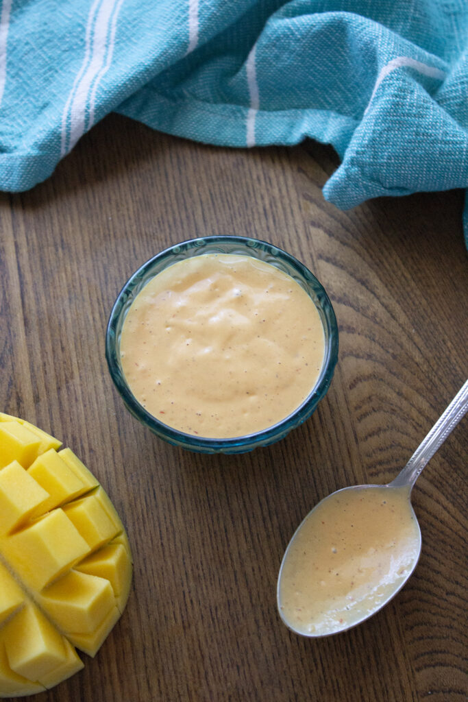 Mango Chipotle Mayo with cut mango and spoon