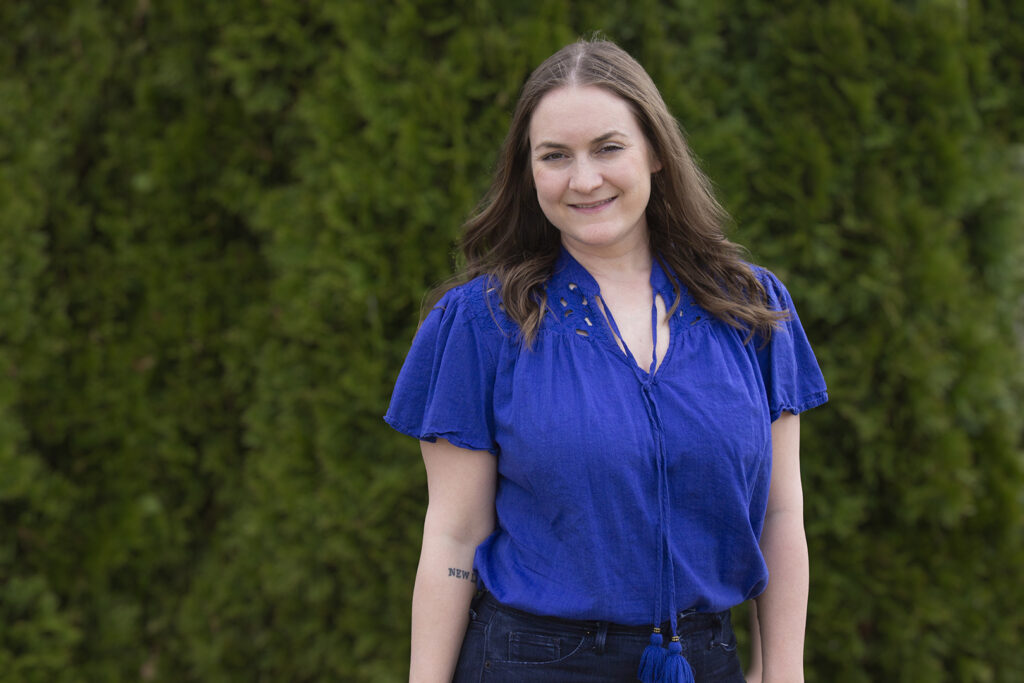 Woman wearing flowy cobalt blue top