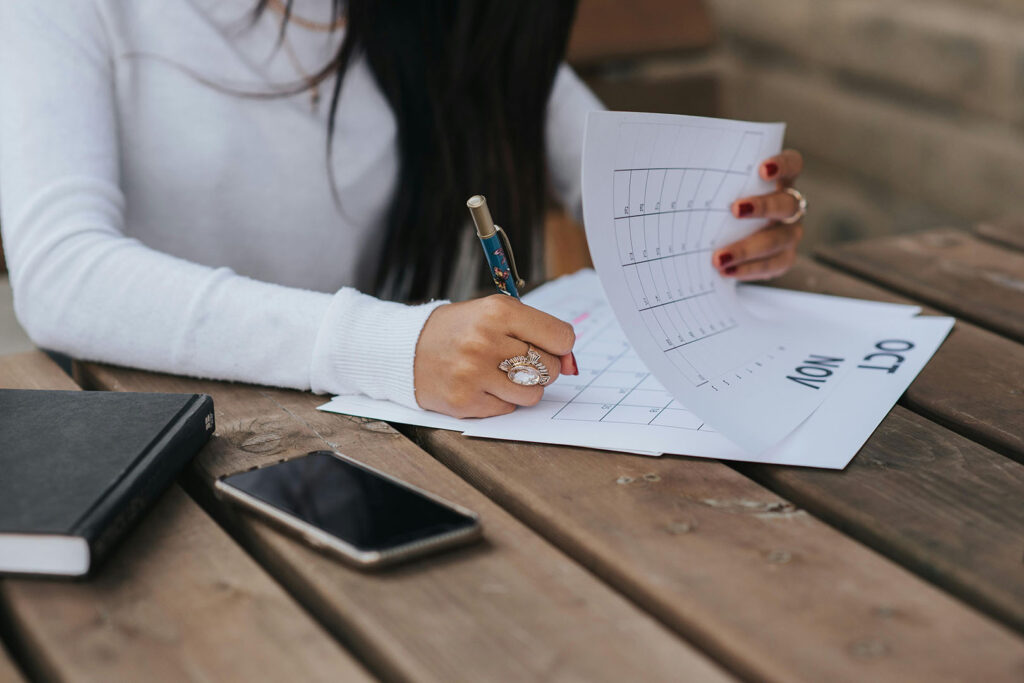 How to Cultivate Discipline: Woman writing on calendar