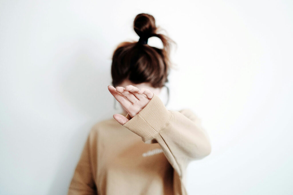 Confronting Our Sin Nature: Woman Blocking Face with Hand