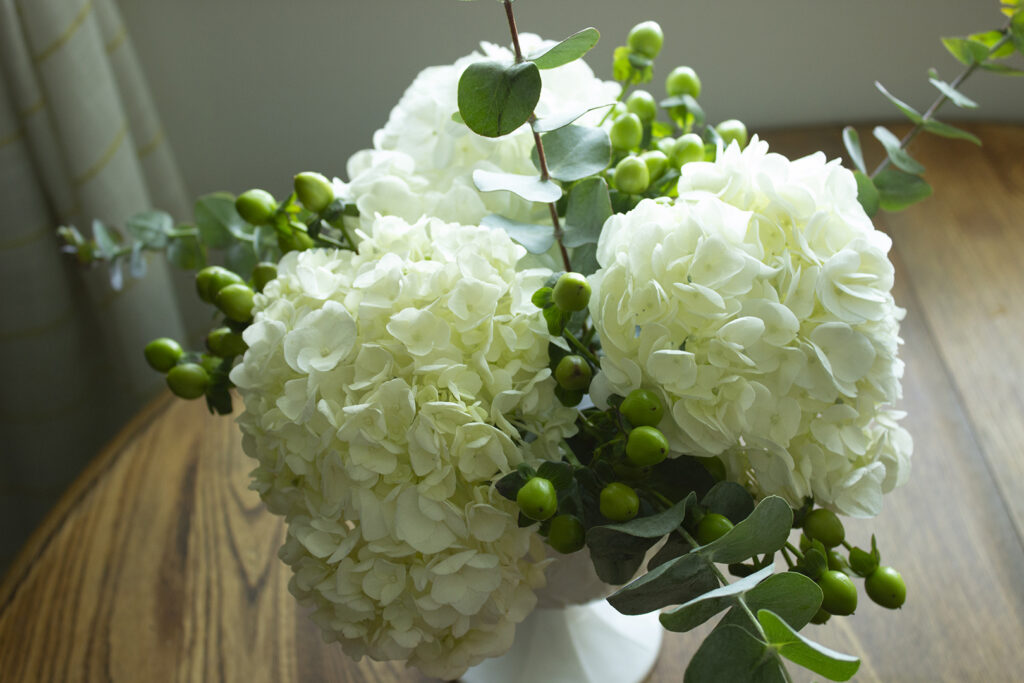 How to Arrange Flowers: Closeup of a white hydrangea floral arrangement