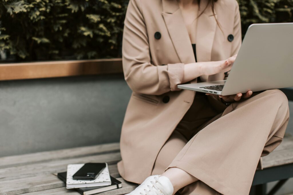 Letting Go of Ambition: Woman in suit on laptop