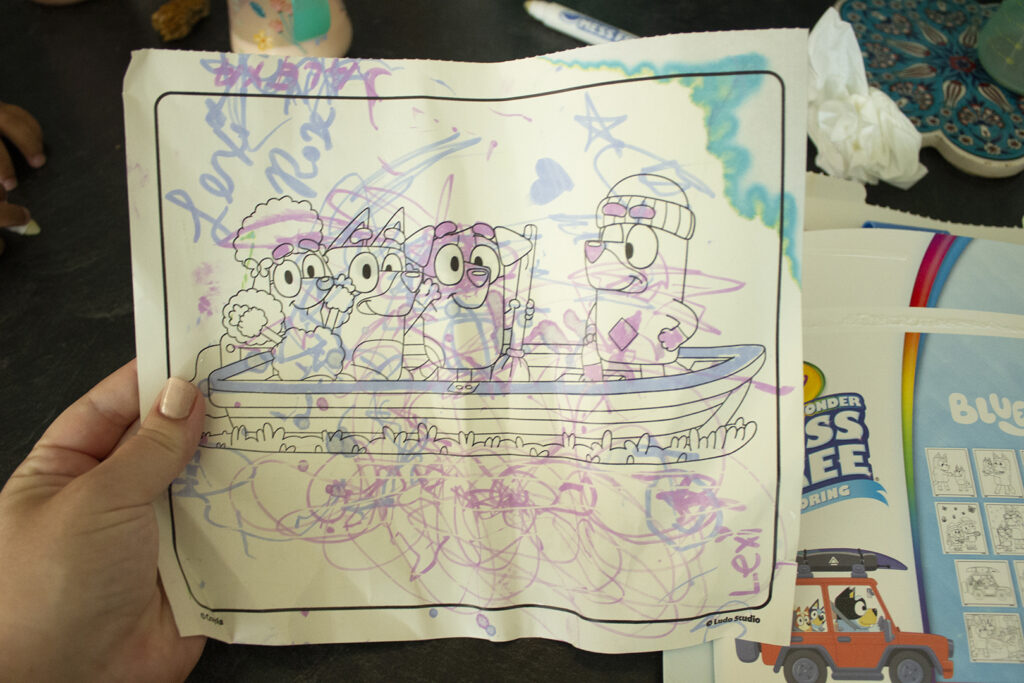Bluey coloring page with colorful scribbles all over
