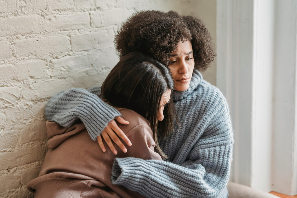 How to Support a Friend With Mental Health: Two women embracing