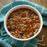 Bowl of chili with blue towel
