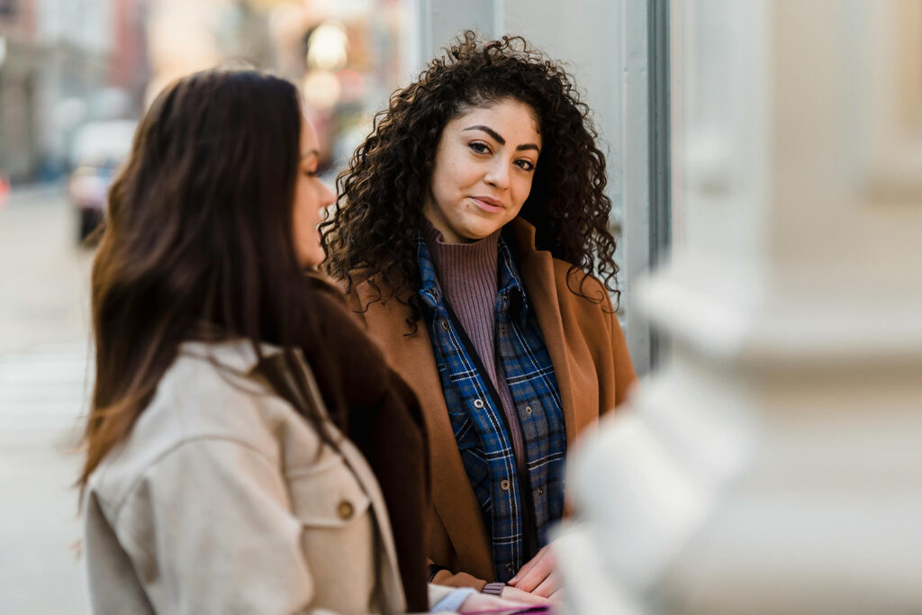 How to Break Up with a friend: Two women together, one is looking at the camera