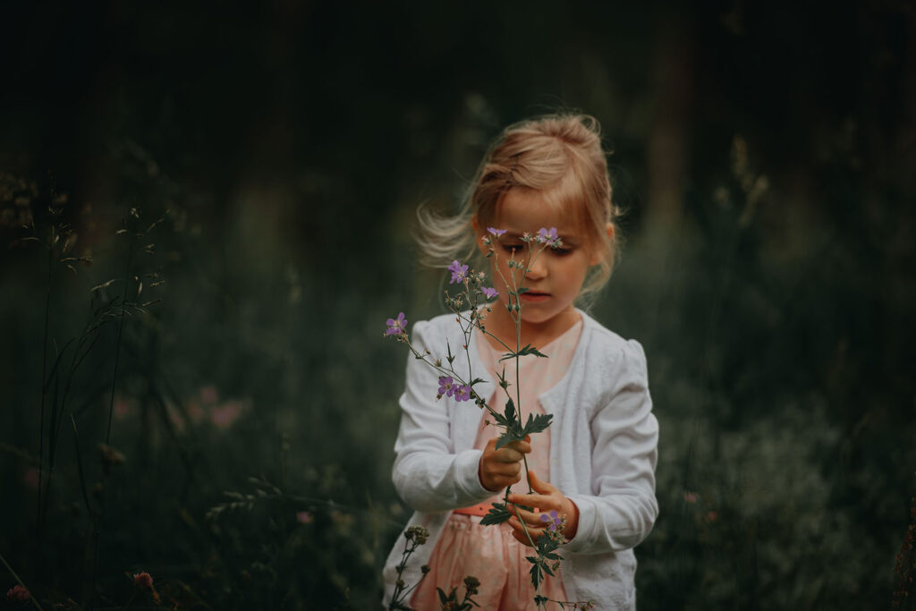 Motherhood: Little Girl holding flowers