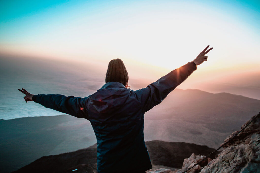 How to Overcome Fear: Hiker with arms outstretched